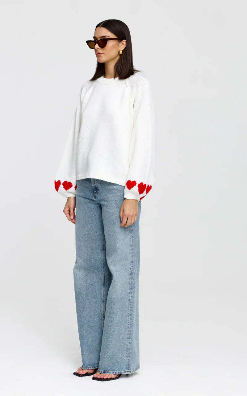 White heart-detail knit sweater with wide-leg jeans, women's fashion