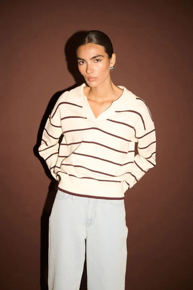 Cream and brown striped V-neck sweater with light wash jeans, women's fashion