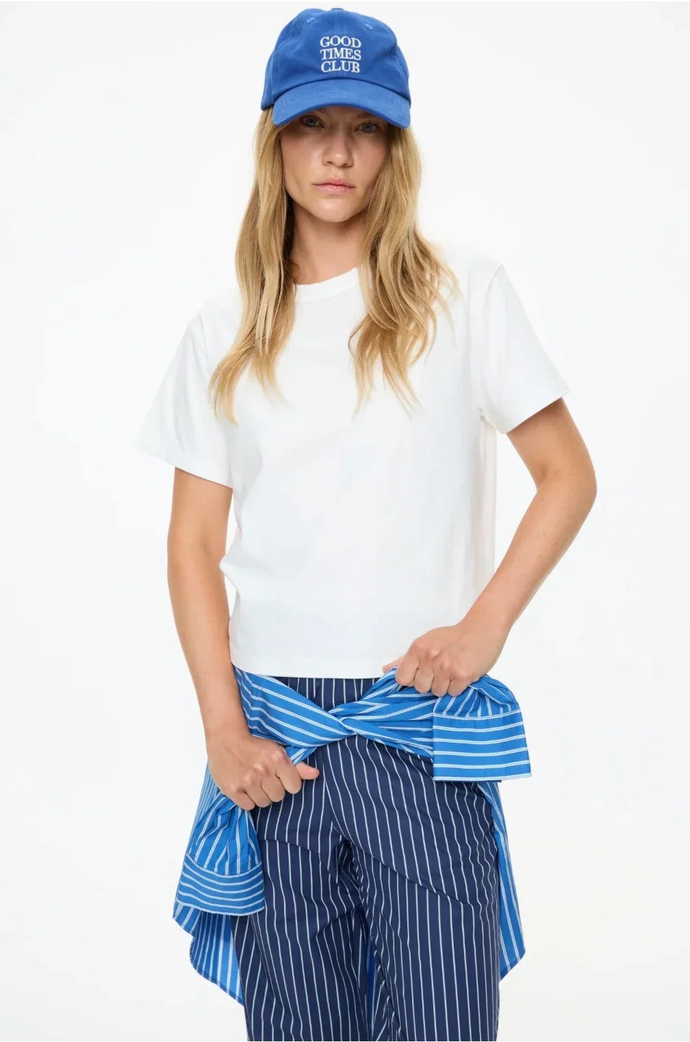 Woman wearing LMND Mimi Cropped Straight Leg Pants with a white t-shirt and blue cap.