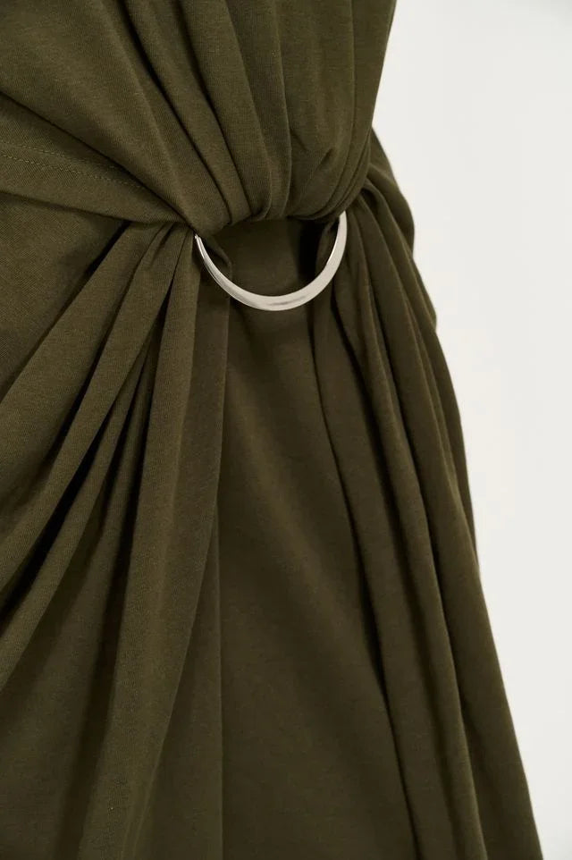 Close-up of the silver ring detail on the olive Staple the Label Tovae Draped Midi Tee Dress