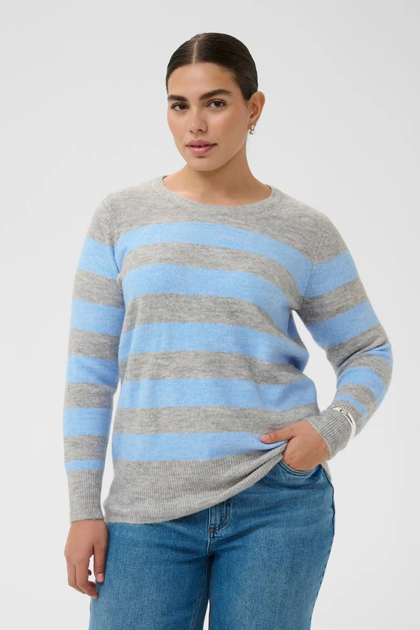 Gray and blue striped sweater with long sleeves paired with jeans