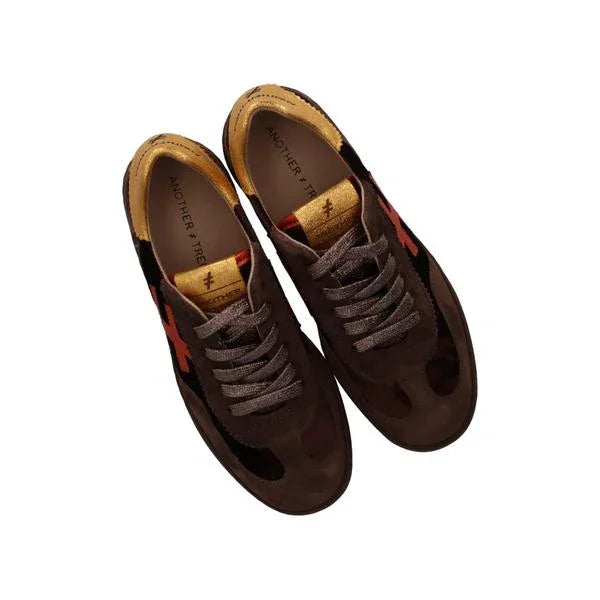 Brown suede women's fashion sneakers with orange side accents and black details