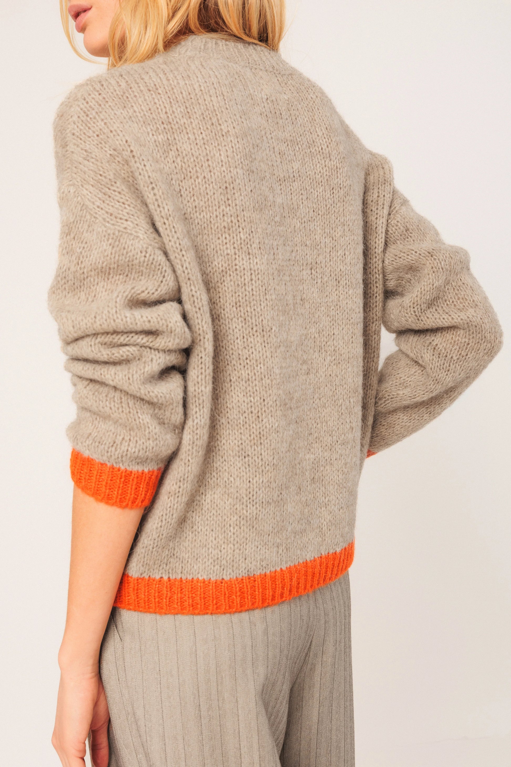 Beige knit sweater with orange trim, women's fashion, cozy winter wear