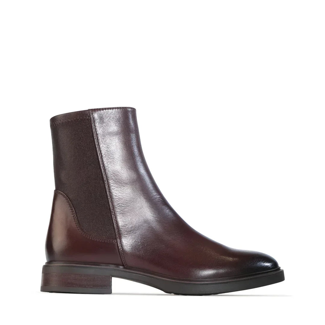 Women's brown leather ankle boot with side panel and low heel on white background