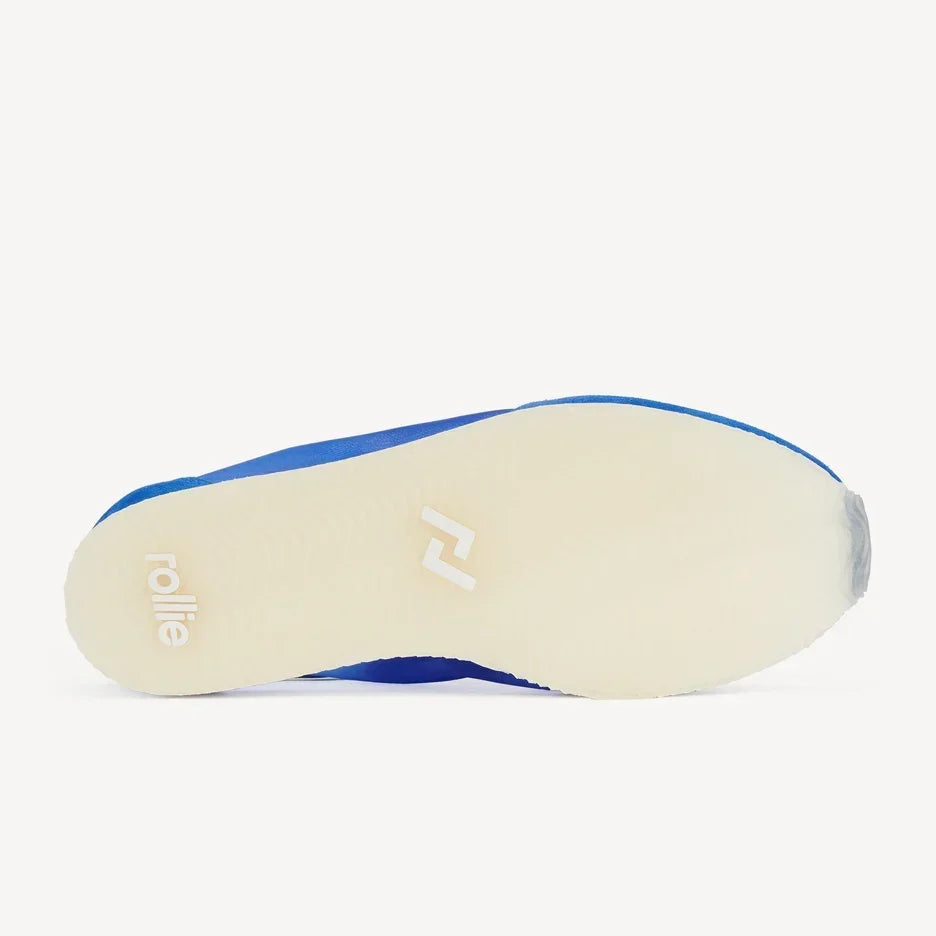 Sole of a Rollie Cruz Sneaker in cobalt blue mesh with a cream-colored outsole.