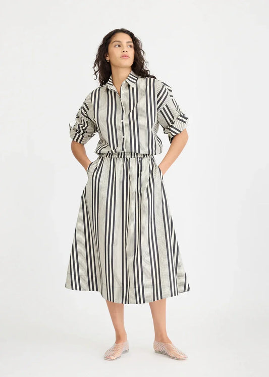 Woman wearing black and white vertical stripe dress from The Tartan Fox, boutique fashion