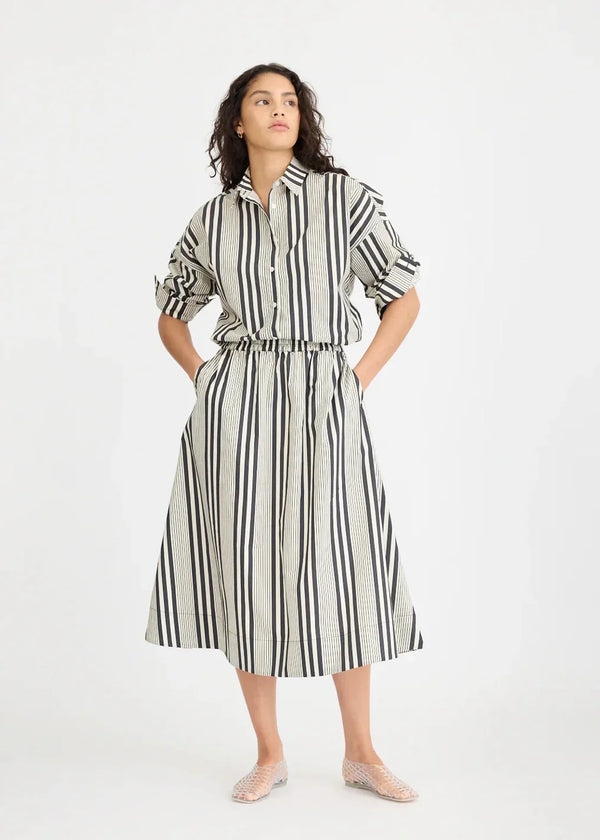 Woman wearing black and white vertical stripe dress from The Tartan Fox, boutique fashion