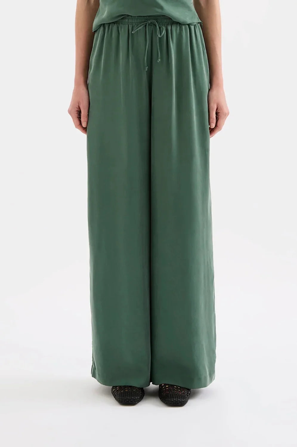 Wide-leg sage green women’s pants with drawstring waist, relaxed fit, front view