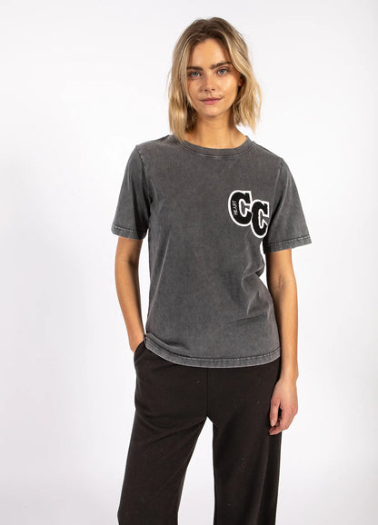 Woman wearing charcoal graphic tee and black pants, boutique fashion at The Tartan Fox