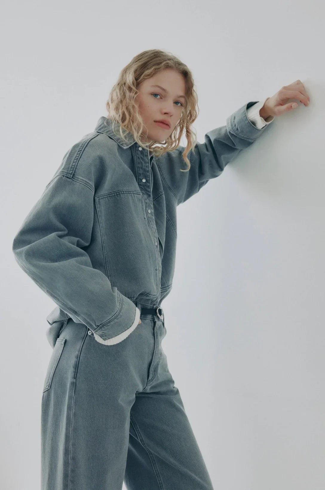 Woman modeling relaxed fit denim jacket and jeans, casual women's fashion look