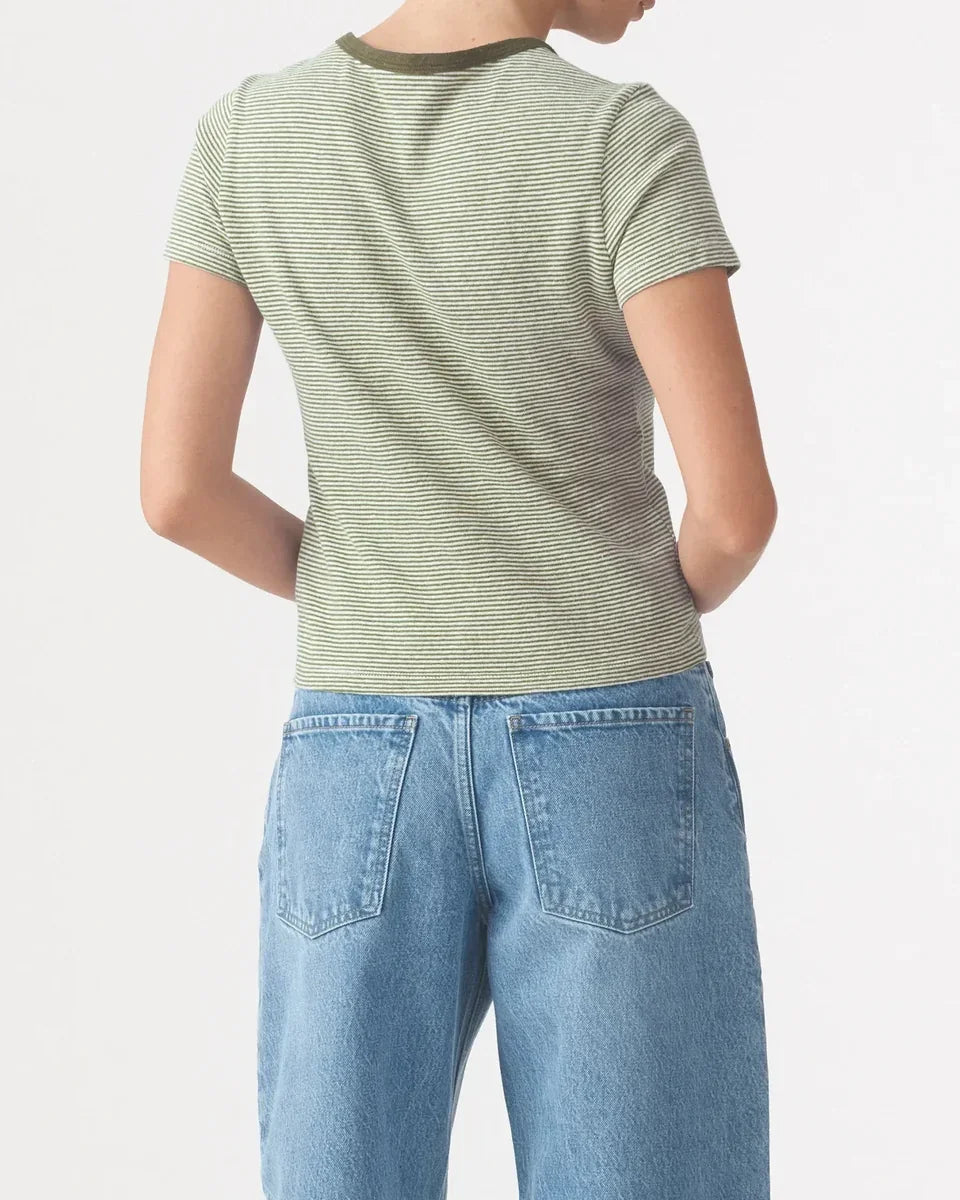 Back view of the Nobody Denim Baby Tee in Olive Stripe paired with blue jeans.