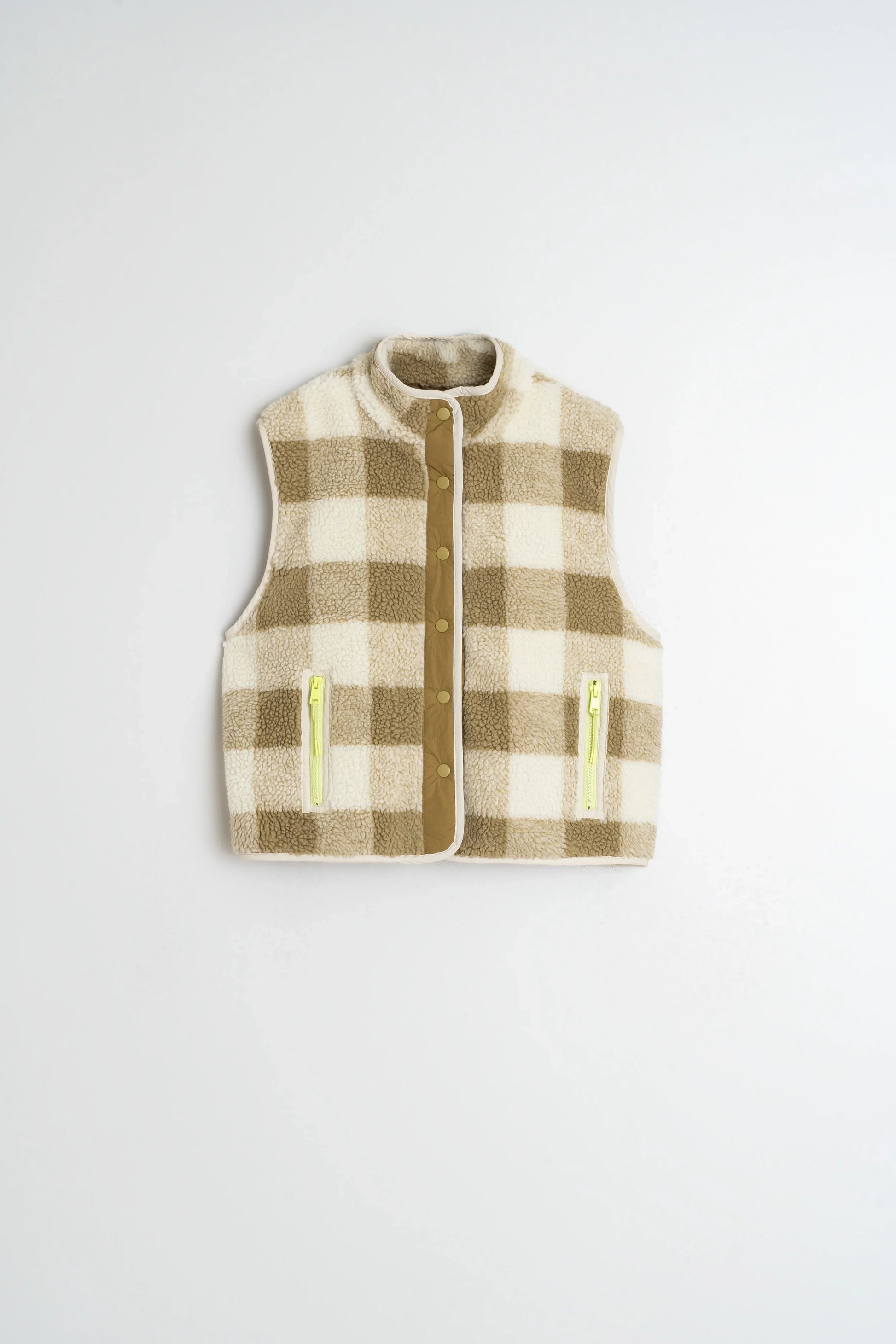 Plaid shearling vest with neon zippers and button front, cozy winter fashion