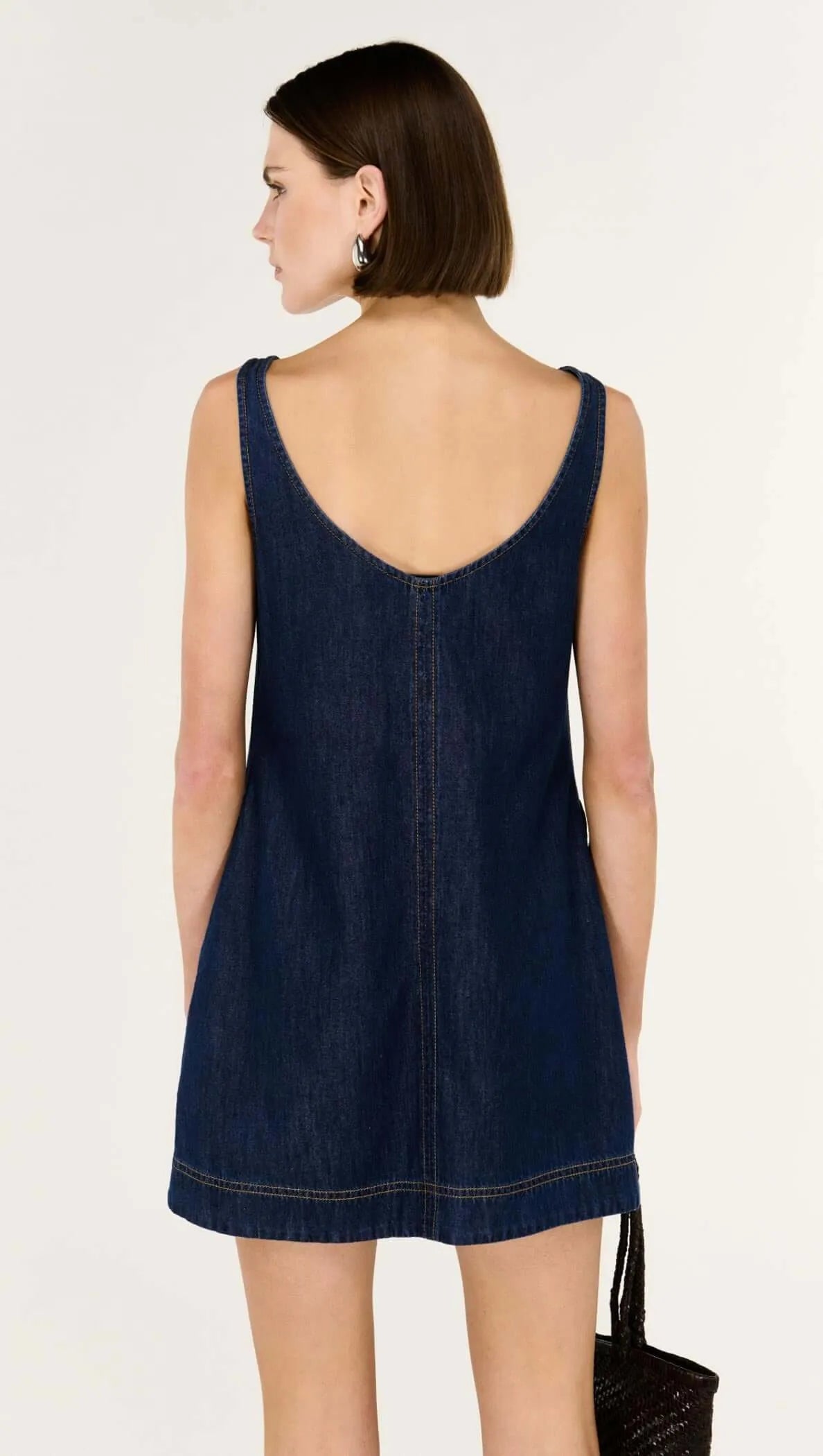 Back View. Dark Denim mini dress with scoop back. The Tartan fox Fashion