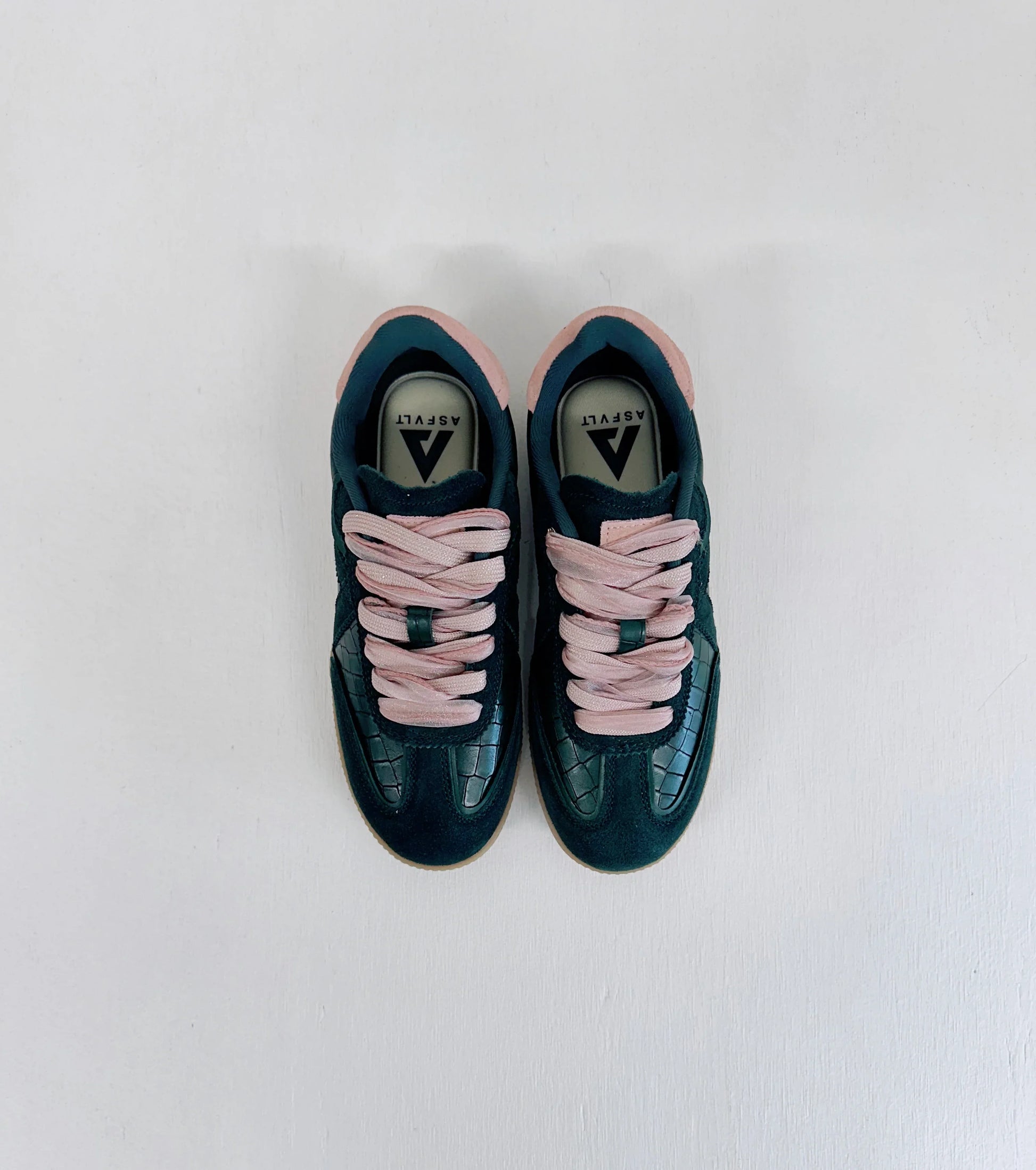 Dark green suede sneakers with pink laces and croc-textured toe, ASFLVLT branding visible