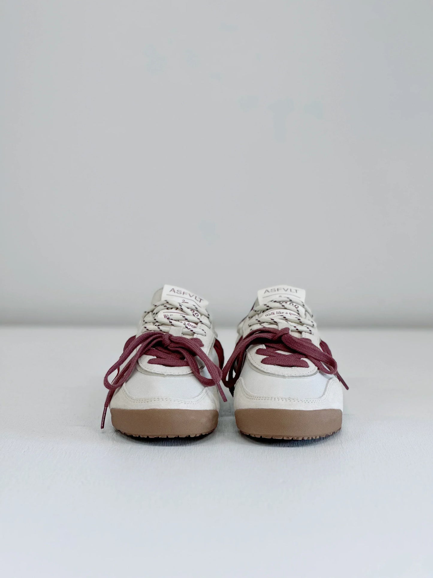 White ASFLVT sneakers with burgundy laces and gum soles, stylish everyday footwear