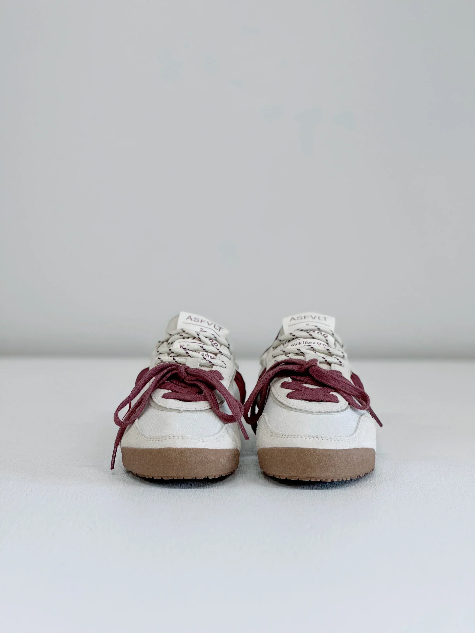 White ASFLVT sneakers with burgundy laces and gum soles, stylish everyday footwear