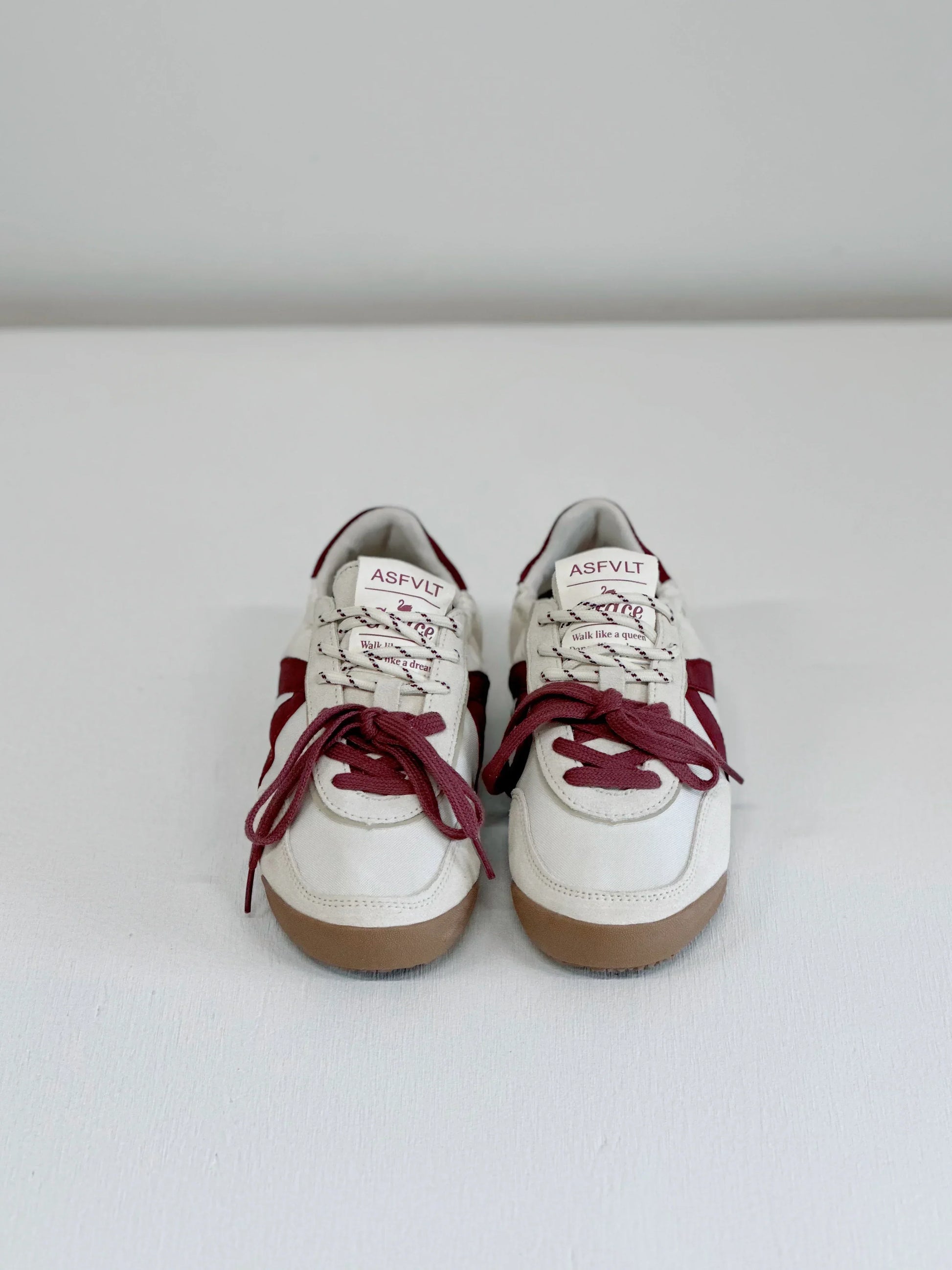 White and burgundy ASFLVT sneakers with gum soles, styled for everyday fashion and comfort.
