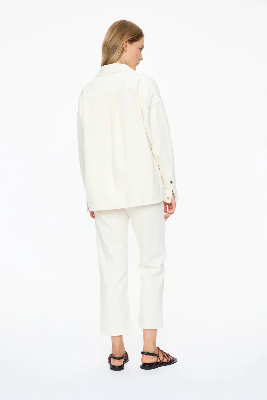 White oversized shirt and cropped pants outfit with strappy sandals