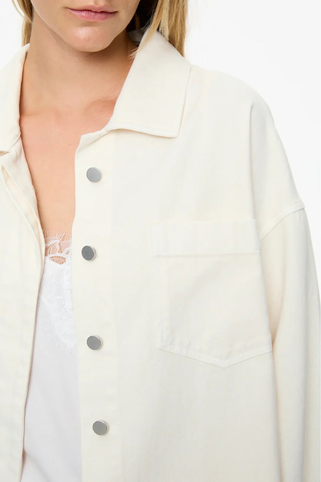 Cream button-up jacket with chest pocket, worn over lace top, women's fashion