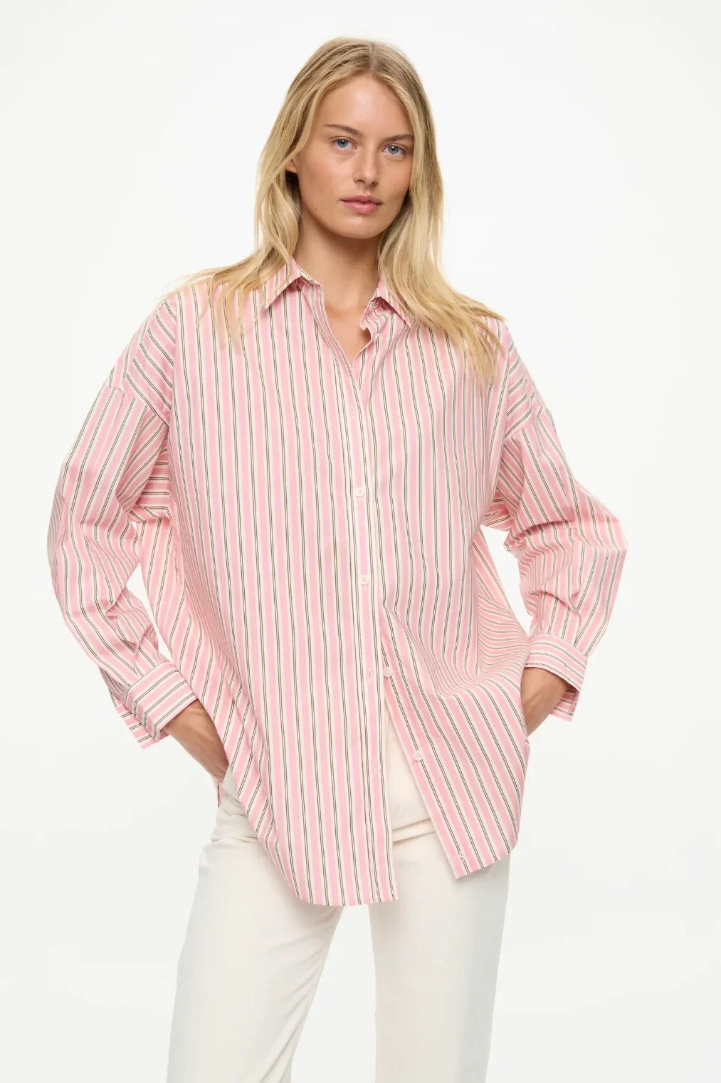 Pink striped button-up shirt with long sleeves, oversized fit, paired with white pants for women's fashion