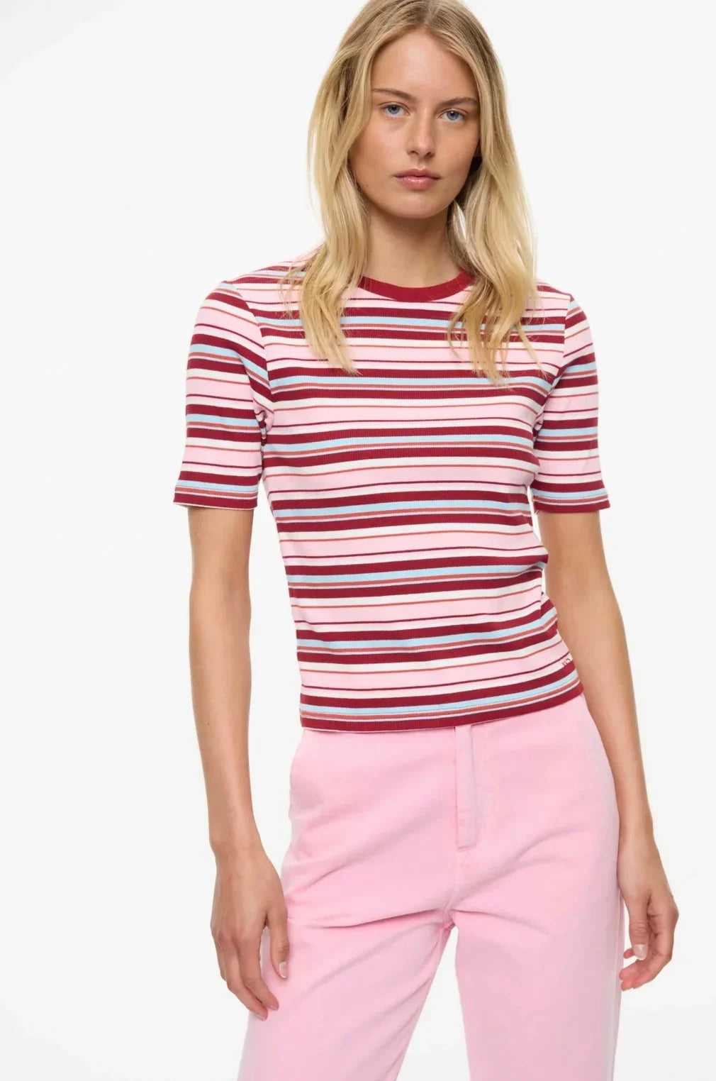 Pink and red striped short sleeve knit top with light blue accents, paired with pink pants