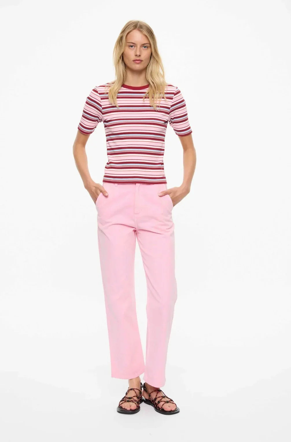 Pink striped tee with light pink pants and strappy sandals