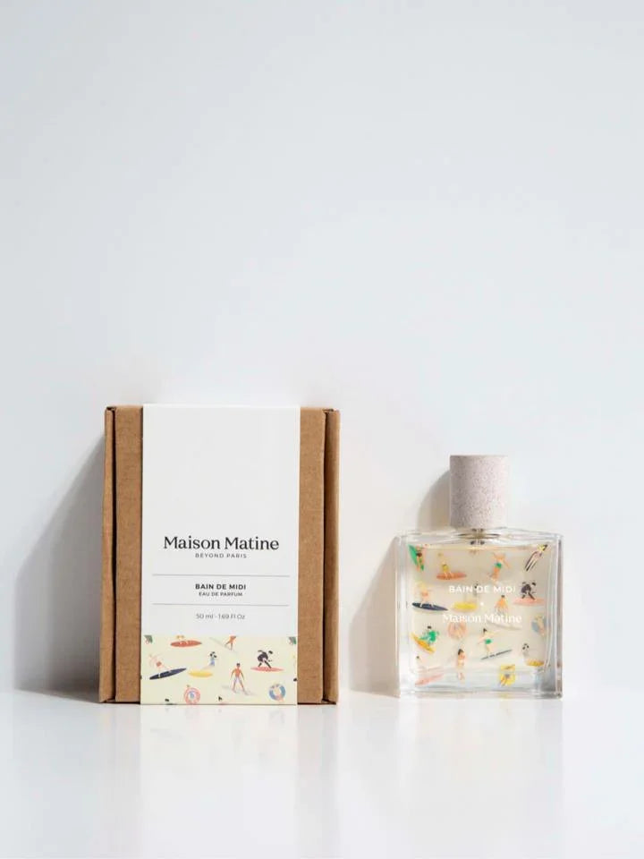 Maison Matine Bain de Midi eau de parfum bottle and box with beach-themed illustrations, minimalist white background