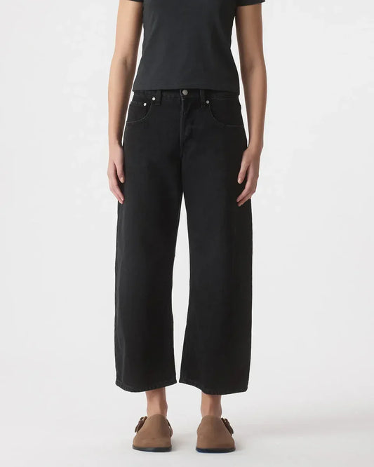 Black wide-leg cropped jeans with black tee and brown loafers, stylish casual women's fashion