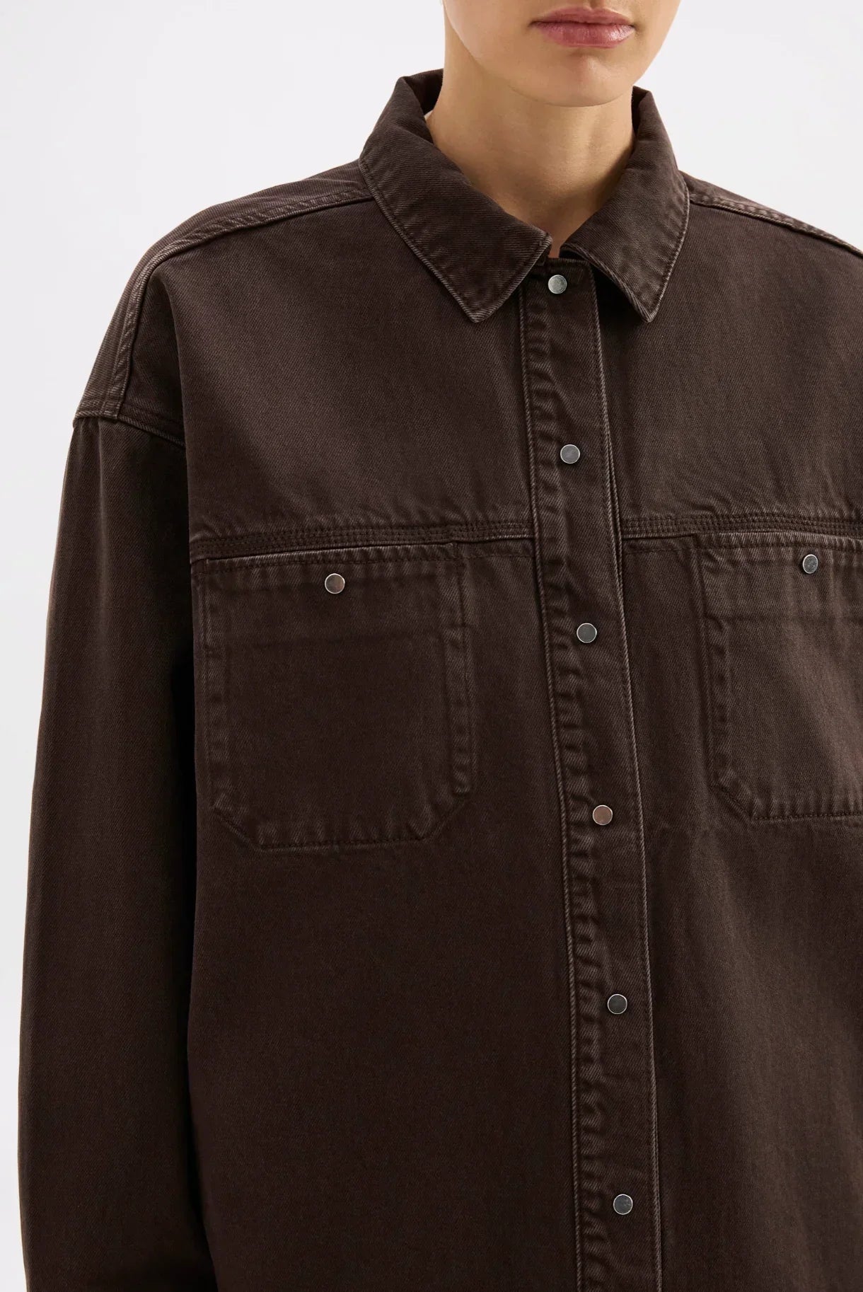 Dark brown oversized button-up shirt with chest pockets, stylish women's fashion
