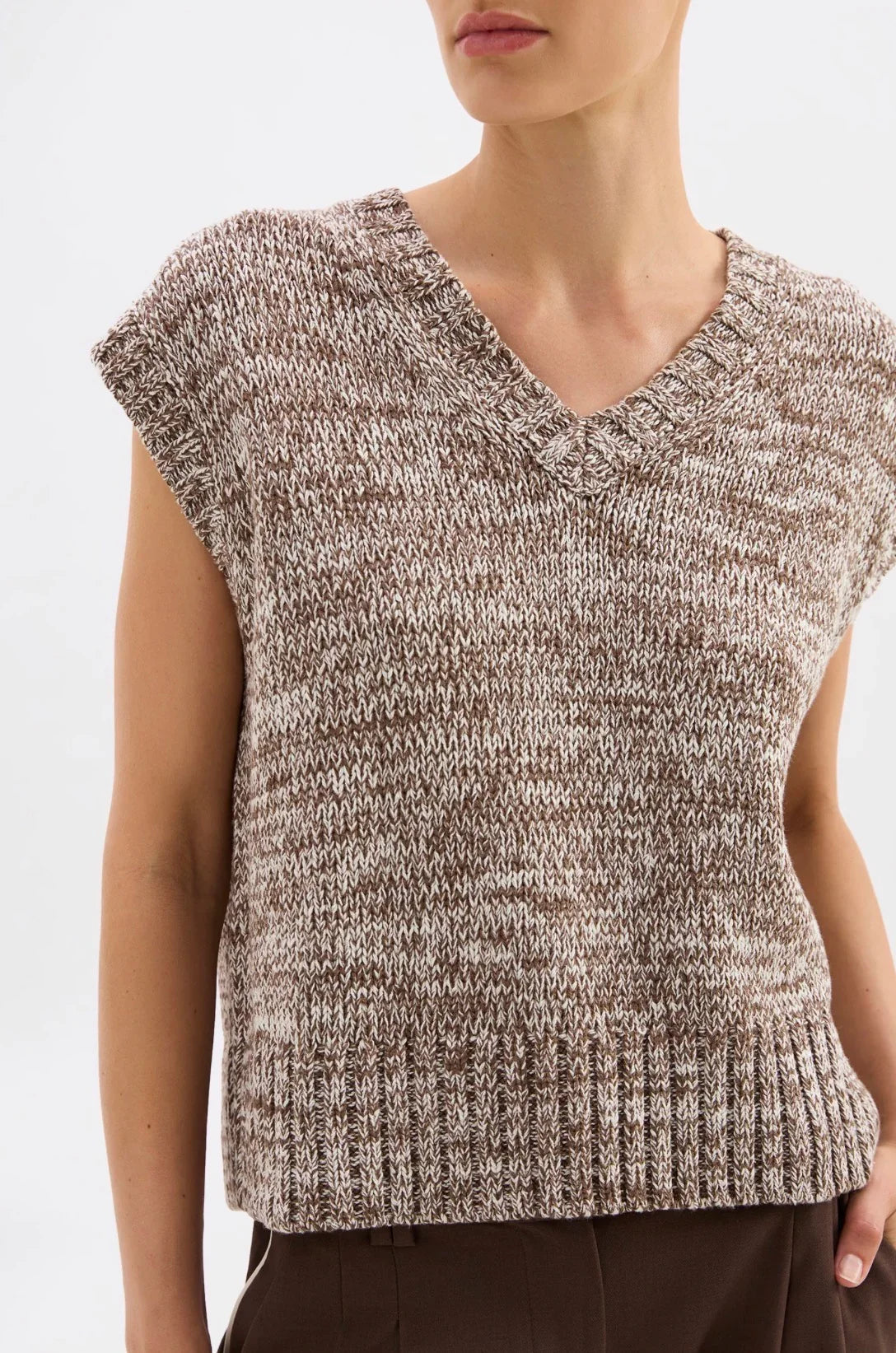 Brown and white marled knit sleeveless top with V-neck and ribbed hem