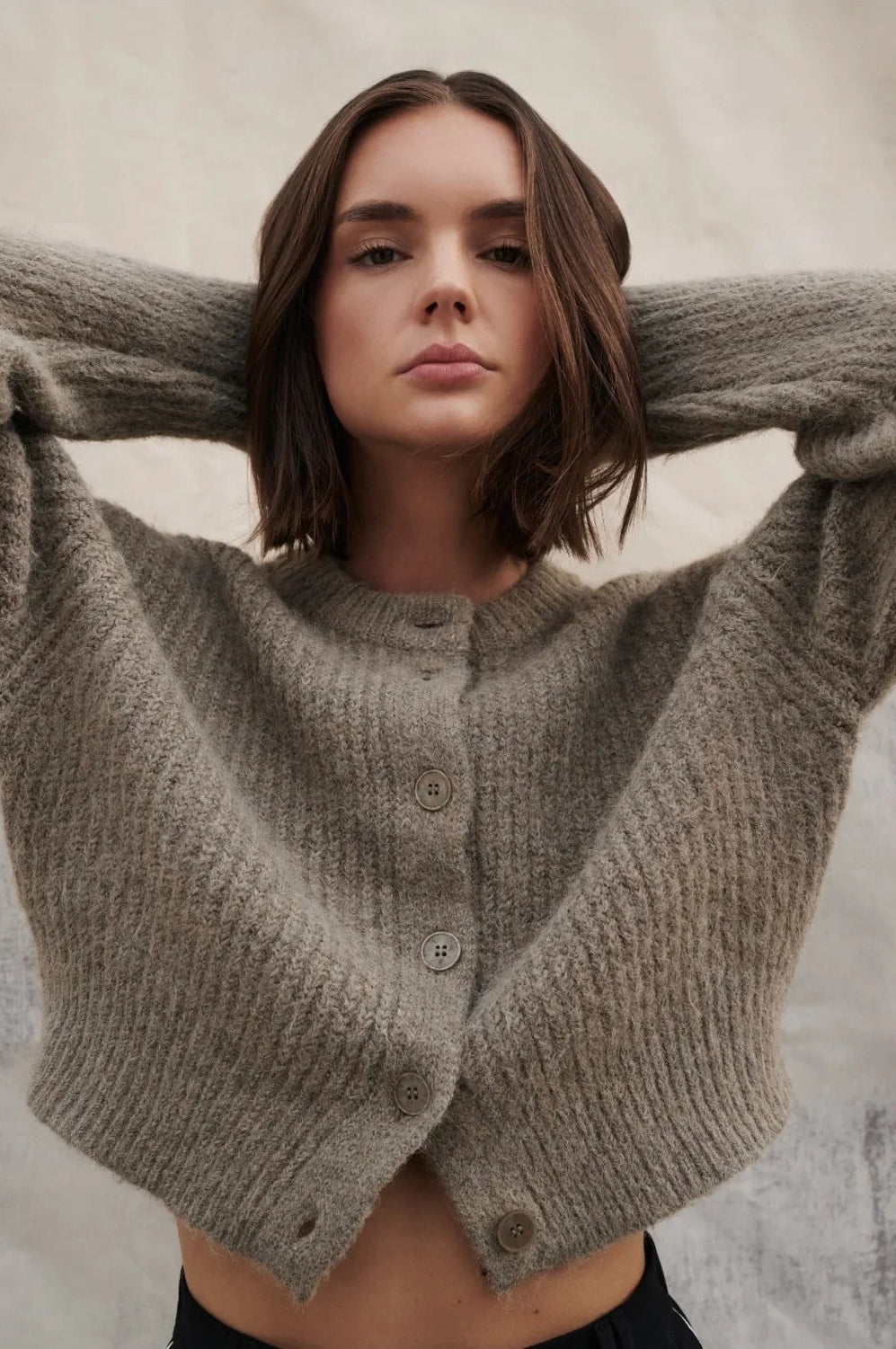 Woman modeling cozy grey button-front cropped cardigan sweater, stylish women's fashion
