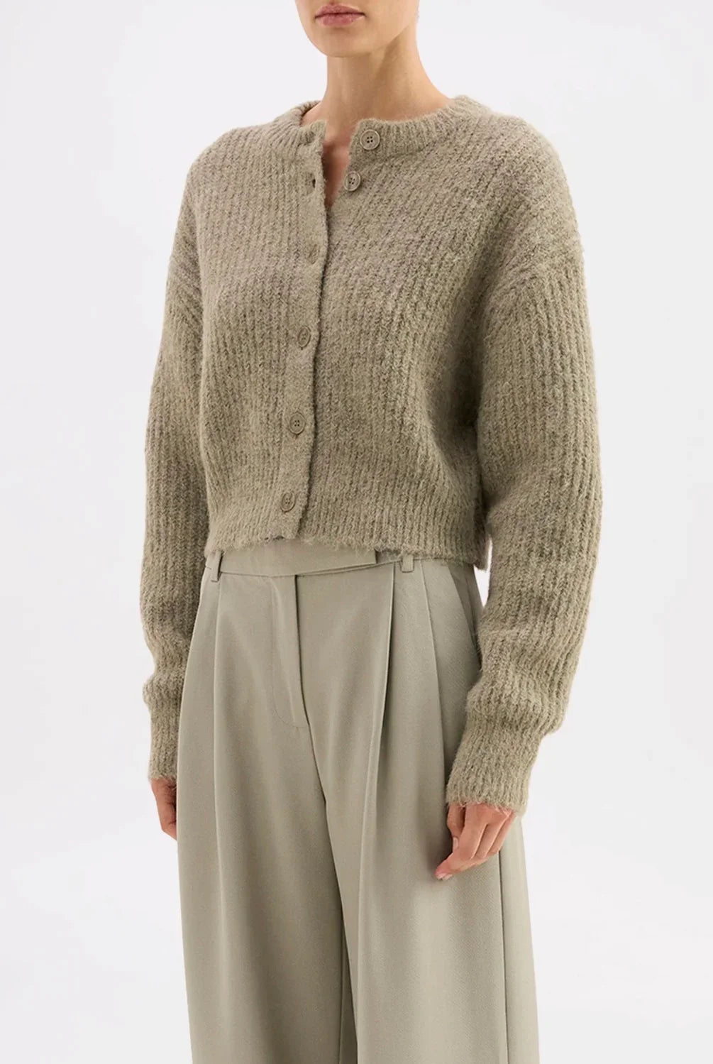 Soft ribbed knit cardigan with buttons paired with wide-leg trousers
