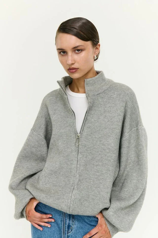 Grey ribbed zip-up sweater with balloon sleeves, styled with blue jeans for women's fashion